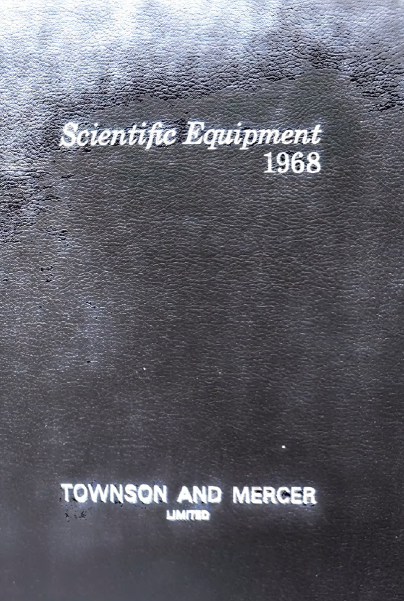 A black leather surface with white text
Description automatically generated